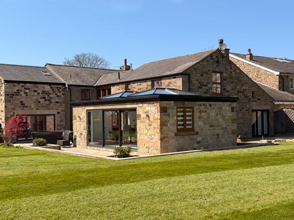 Stone Extension with Sliding Patio Doors